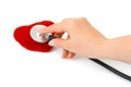Stethoscope in hand and heart Royalty Free Stock Photo