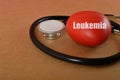 Stethoscope and heart with text LEUKEMIA. Leukemia is a type of cancer that affects the blood and bone marrow, where blood cells
