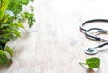 Stethoscope and herbs healthy life style and alternative medicine background concept