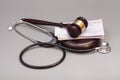 Stethoscope with judge gavel and euro banknotes Royalty Free Stock Photo