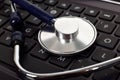 Stethoscope on keyboard Royalty Free Stock Photo