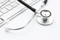 Stethoscope on the keyboard Royalty Free Stock Photo