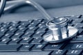 Stethoscope on the laptop keyboard Royalty Free Stock Photo