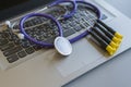 Stethoscope on laptop keyboard. Health care or IT security concept. Laptop repair concept. Computer repair concept Close-up view. Royalty Free Stock Photo