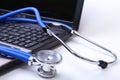 Stethoscope on laptop keyboard,stethoscope on the keyboard of pc,Medical Stethoscope Resting on Desk,relax time doctor Royalty Free Stock Photo