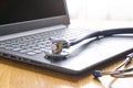 Stethoscope lay on  computer with pen and glasses, documents. work space Royalty Free Stock Photo