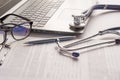 Stethoscope lay on  computer with pen and glasses, documents. work space of doctor Royalty Free Stock Photo