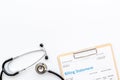 Stethoscope with medical billing statement. Top view Royalty Free Stock Photo