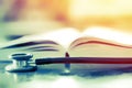 Stethoscope and medical book on table study, medical concept student education care health in hospital , sunlight selective focus.