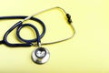 Stethoscope medical equipment on yellow Royalty Free Stock Photo