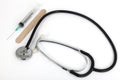 Stethoscope and medical syring Royalty Free Stock Photo