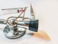 Stethoscope and minor O.T. equipments on the white table Royalty Free Stock Photo