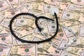 Stethoscope on money background Royalty Free Stock Photo