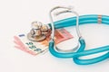 Stethoscope on money background Royalty Free Stock Photo