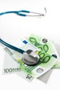 Stethoscope and money bills Royalty Free Stock Photo