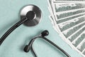 Stethoscope and money, concept. Paid medicine. Costs for the medical insurance Royalty Free Stock Photo