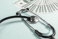 Stethoscope and money, concept. Paid medicine. Costs for the medical insurance Royalty Free Stock Photo