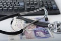 Stethoscope,money, keyboard on white, medical concept. Royalty Free Stock Photo