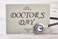 Stethoscope near Doctor`s Day card. Royalty Free Stock Photo