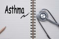 Stethoscope on notebook and pencil with Asthma words as medical