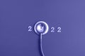 Stethoscope number 2022 on very peri background creative idea new trend medical banner calendar cover closeup with copy