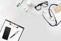 Stethoscope in the office of doctors.Top view of doctor`s desk table, blank paper on clipboard with pen. Copy space Royalty Free Stock Photo