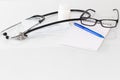 Stethoscope in the office of doctors.Top view of doctor`s desk table, blank paper on clipboard with pen. Copy space Royalty Free Stock Photo