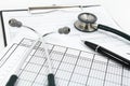 Stethoscope and pen on blank Patient information