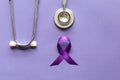 Stethoscope and person with purple ribbon on purple background, Symbol of Alzheimers awareness, Healthcare and medicine concept