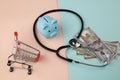 Stethoscope,piggy and money - a business concept in medicine Royalty Free Stock Photo