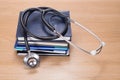 Stethoscope on pile of planners Royalty Free Stock Photo