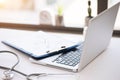 Stethoscope, pills, laptop on white background. Medicine concept Royalty Free Stock Photo