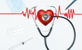 Stethoscope and red heart. Doctor table with medical items Royalty Free Stock Photo