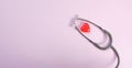 Close up Stethoscope and red heart on pale pink isolated background with copy space for text. Close up, top view. Medical equipme