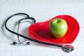 Stethoscope and a red heart plate diet concept