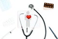 Stethoscope and red heart. Doctor table with medical items Royalty Free Stock Photo