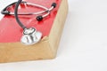 Stethoscope on red old book Royalty Free Stock Photo