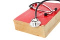 Stethoscope on red old book Royalty Free Stock Photo