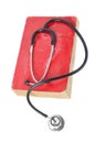 Stethoscope on red old book Royalty Free Stock Photo