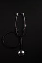 Stethoscope reflection on black background