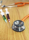 Stethoscope and syring Royalty Free Stock Photo
