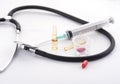 Stethoscope, syringe, ampules and pills