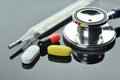 Stethoscope, Thermometer, Pills and Capsule