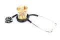 Stethoscope wrapped around roll of paper euro notes Royalty Free Stock Photo