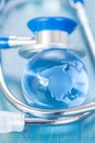 Stetoscope and glass globe Royalty Free Stock Photo