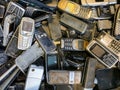 Stevenage, Hertfordshire, UK - January 31st 2020: a large heap of vintage mobile phones ready to be recycled.