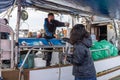 Steveston Harbour Fisherman Wharf. Fishermen sell fish on the boat. People wearing face mask during covid-19 pandemic period.