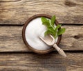 Stevia rebaudiana, sweet leaf sugar substitute isolated in wooden bowl on wooden background Royalty Free Stock Photo