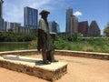 Stevie Ray Vaughan Statue with Austin Texas in Background