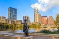 Stevie Ray Vaughan statue in front of downtown Austin and the Co